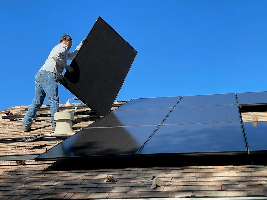 Solar installer connecting panels to the home energy system
