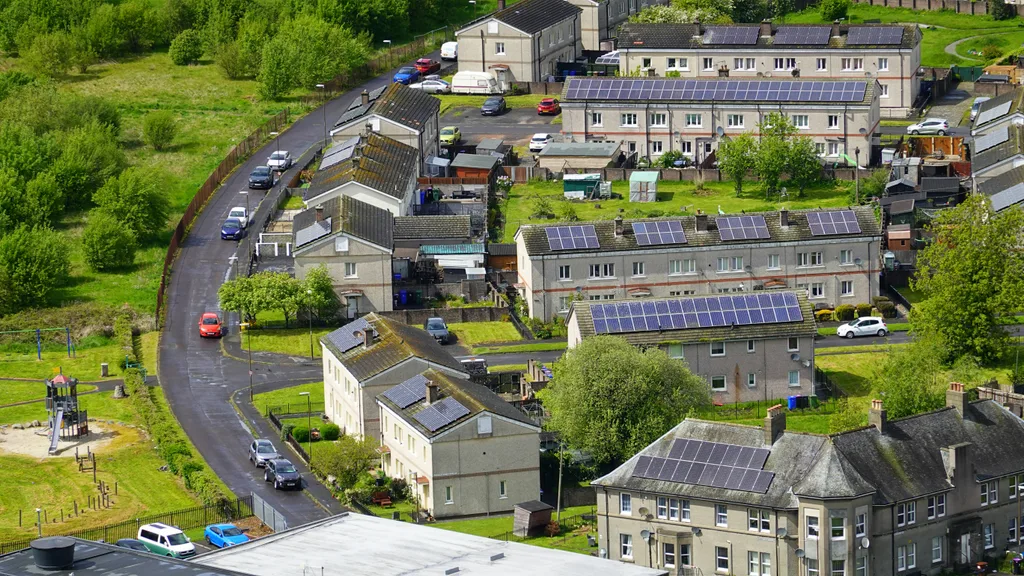 Aerial view of solar panels across residential rooftops